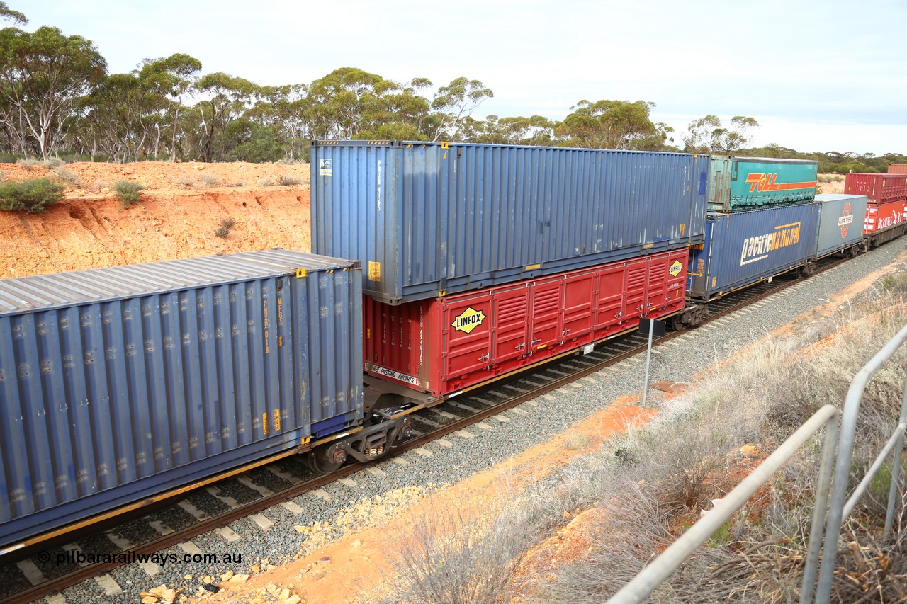 160526 5223
West Kalgoorlie, 4PM6 intermodal train, RRAY 7260 platform 3 of 5-pack articulated skel waggon set, one of a hundred built by ABB Engineering NSW in 1996-2000, 48' deck with a 40' Linfox half height side door LSDU 694010 and a Pacific National 48' Royal Wolf box PNXD 4165 on top.
Keywords: RRAY-type;RRAY7260;ABB-Engineering-NSW;