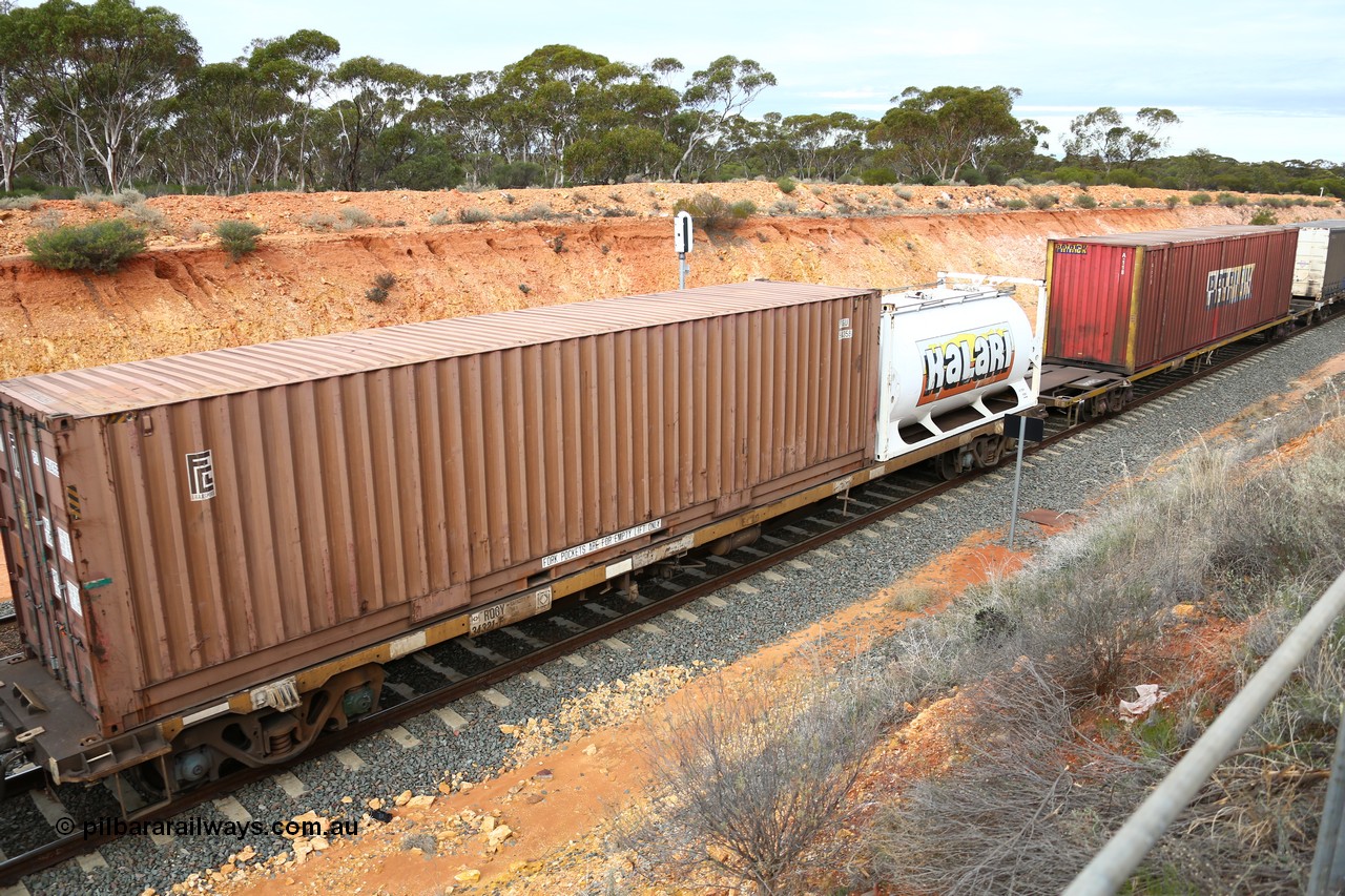 160526 5231
West Kalgoorlie, 4PM6 intermodal train, RQGY 34321 container waggon, one of a batch of one hundred built by Goninan NSW in 1974-75 as OCY class, recoded to NQOY, then NQSY, 40' FCL container FCGU 964359 and a Jamieson built 20' tanktainer for Kalari K 8124.
Keywords: RQGY-type;RQGY34321;Goninan-NSW;OCY-type;NQOY-type;NQSY-type;