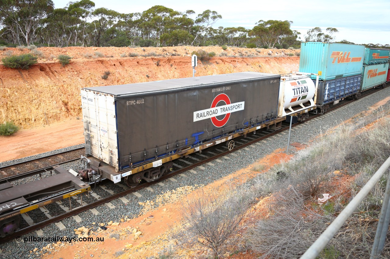 160526 5233
West Kalgoorlie, 4PM6 intermodal train, RRDY 119 container waggon with a 40' Railroad Transport curtainsider RTPC 4002 and a 20' Jamieson built Titan tanktainer. Unsure of the history of these RRDY class waggons, they appear to be SAR Islington built FQX type waggons.
Keywords: RRDY-type;RRDY119;SAR-Islington-WS;FQX-type;