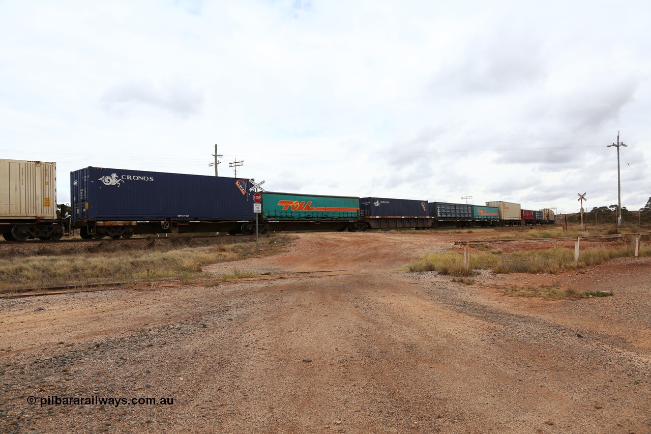 160526 5256
Parkeston, 3MP7 priority service train, view of articulated 5-pack centre well waggon set RQLY 1008, one of fourteen built by AN Rail Islington Workshops 1991 as AQLY type, loaded with Cronos and Toll 40' boxes, half height and curtainsiders.
Keywords: RQLY-type;RQLY1008;AN-Islington-WS;AQLY-type;