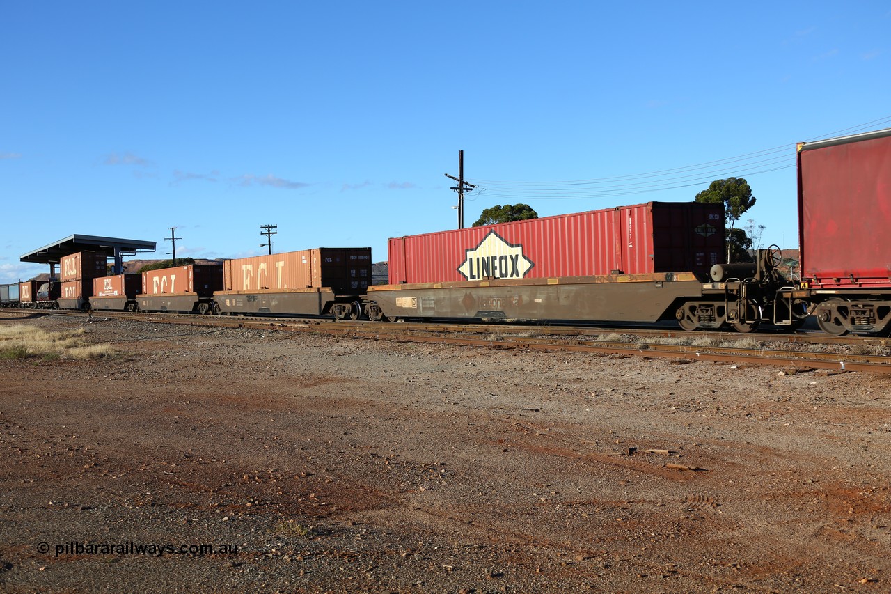 160528 8340
Parkeston, 5SP5 intermodal train, RRZY 7031, originally built by Goninan NSW during 1995/95 as part of thirty four sets of five unit bar coupled well container waggons coded RQZY, recoded to RRZY as repairs were carried out to strengthen them. Loaded with 48' containers, five for FCL FBCU conatiners and one Linfox DRC 931.
Keywords: RRZY-type;RRZY7031;Goninan-NSW;RQZY-type;