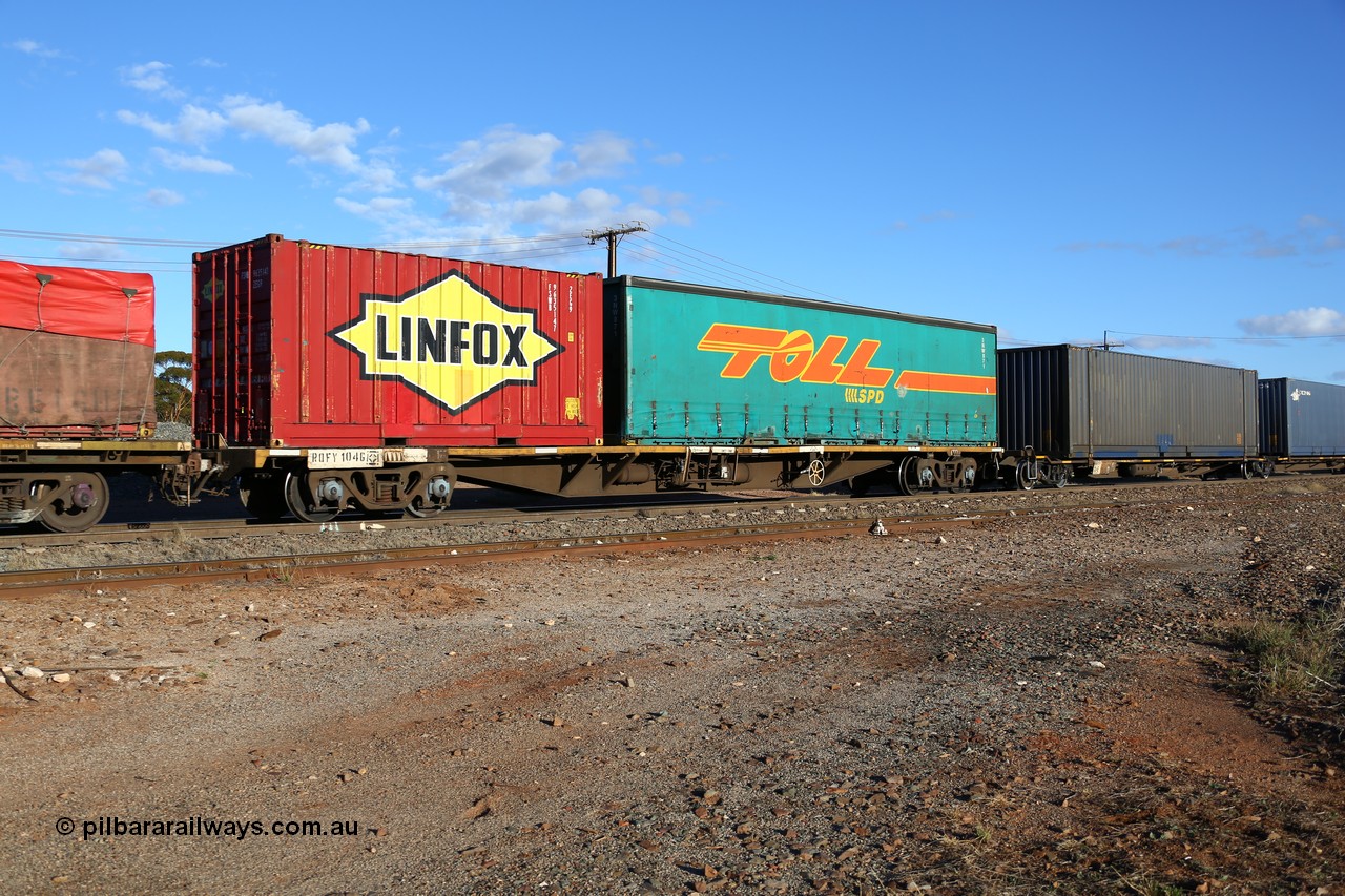 160528 8352
Parkeston, 5SP5 intermodal train, RQFY 104 container waggon, built by Victorian Railways Bendigo Workshops in 1980 as a batch of seventy five VQFX type skeletal container waggons, recoded in April 1994 RQFY and 2CM bogies fitted August 1995. With a Toll 40' curtainsider 3NW 871 and a Linfox 20' 2EG9 type box FSWB 9635147.
Keywords: RQFY-type;RQFY104;Victorian-Railways-Bendigo-WS;VQFX-type;