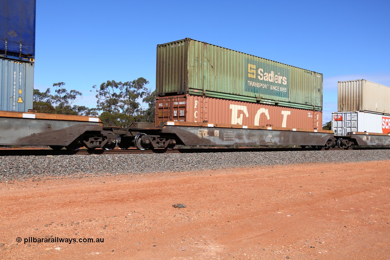 160528 8417
Binduli, intermodal train 6PM6, RRZY type five unit bar coupled well container waggon set RRZY 7016 platform 3, originally built by Goninan in a batch of twenty six RQZY type for National Rail, recoded when repaired. FCL 48' container FSGU 488445 double stacked with Sadleirs 48' container RCS 4816.
Keywords: RRZY-type;RRZY7016;Goninan-NSW;RQZY-type;