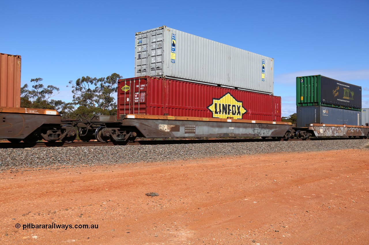 160528 8423
Binduli, intermodal train 6PM6, RRZY type five unit bar coupled well container waggon set RRZY 7030 platform 2, originally built by Goninan in a batch of twenty six RQZY type for National Rail, recoded when repaired. 48' MFG1 type Linfox container FXDU 328062 double stacked with a Royal Wolf 4EG1 type 40' container RWTU 941116.
Keywords: RRZY-type;RRZY7030;Goninan-NSW;RQZY-type;
