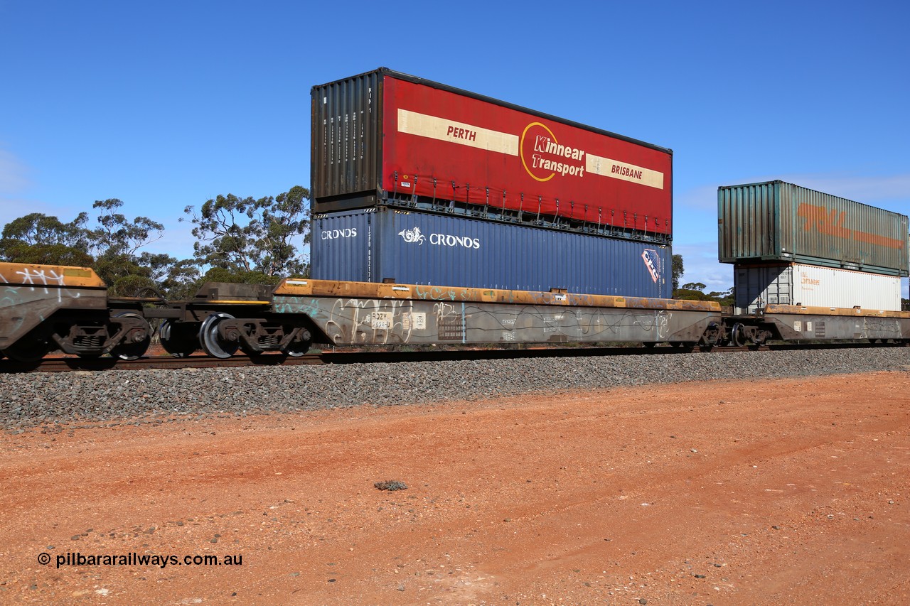 160528 8430
Binduli, intermodal train 6PM6, RQZY 7054 platform 3 of five unit bar coupled well container waggon set built in a batch of thirty two by Goninan NSW in 1995/96, loaded with a Cronos 40' 4EG1 type container TSPD 092174 double stacked with a Kinnear Transport 40' curtain sider container KIN 1.
Keywords: RQZY-type;RQZY7054;Goninan-NSW;