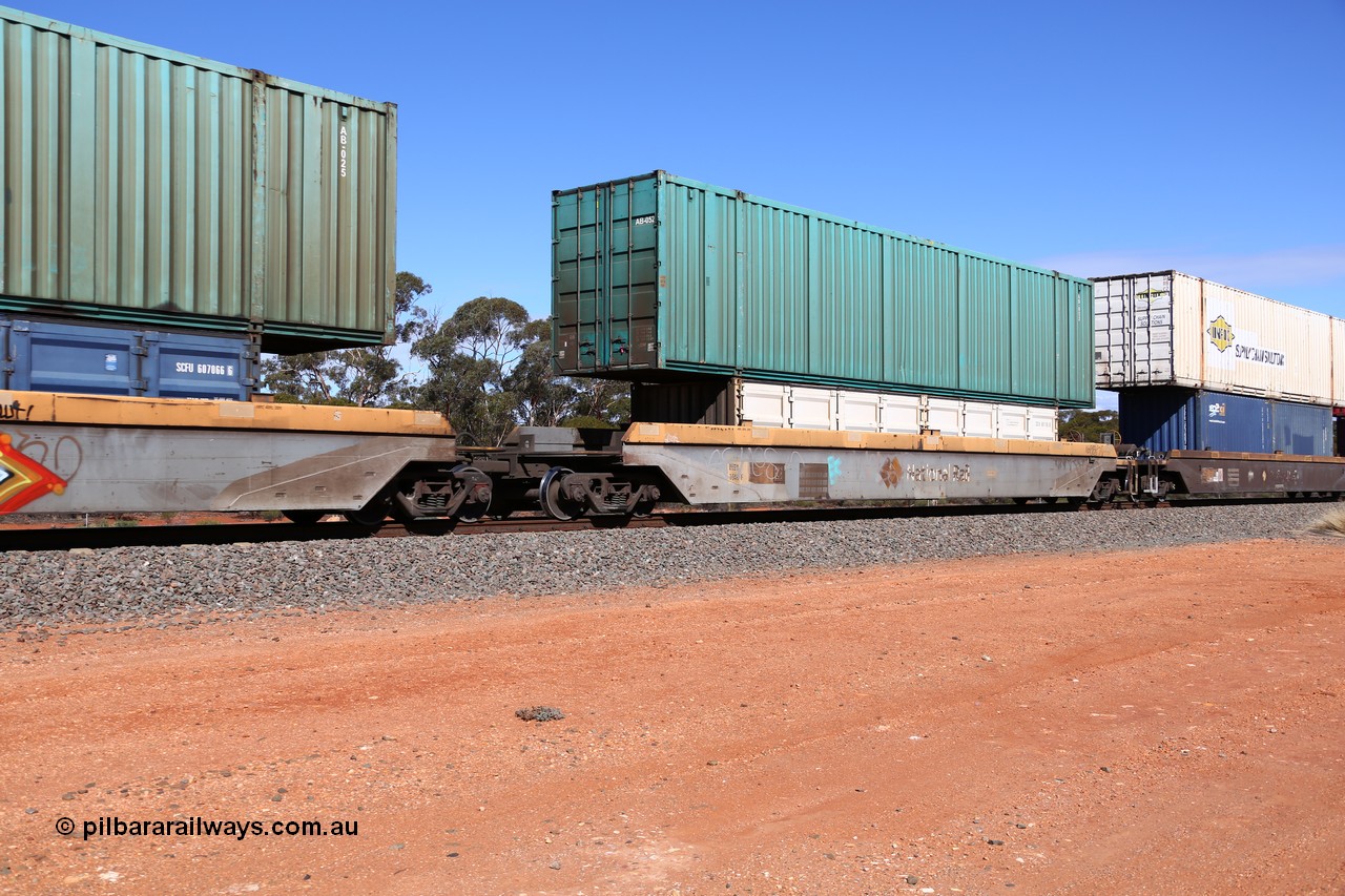 160528 8442
Binduli, intermodal train 6PM6, RQZY 7040 platform 1 of five unit bar coupled well container waggon set built in a batch of thirty two by Goninan NSW in 1995/96, loaded with a 40' half height side door container SCFU 607105[0] double stacked with a Toll 53' car container AB 052.
Keywords: RQZY-type;RQZY7040;Goninan-NSW;