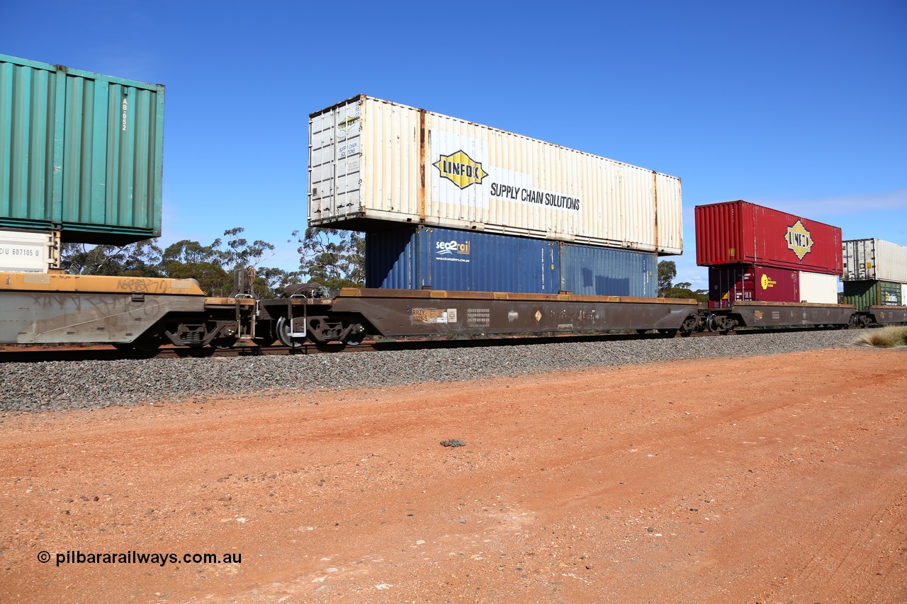 160528 8443
Binduli, intermodal train 6PM6, RRZY type five unit bar coupled well container waggon set RRZY 7023 platform 5, originally built by Goninan in a batch of twenty six RQZY type for National Rail, recoded when repaired. Loaded with a 20' Sea2Rail 2EG1 type container SCFU 207687[7] and a 20' 25G0 type container RWTU 737019[1] double stacked with a Linfox 53' car container DRC 362.
Keywords: RRZY-type;RRZY7023;Goninan-NSW;RQZY-type;
