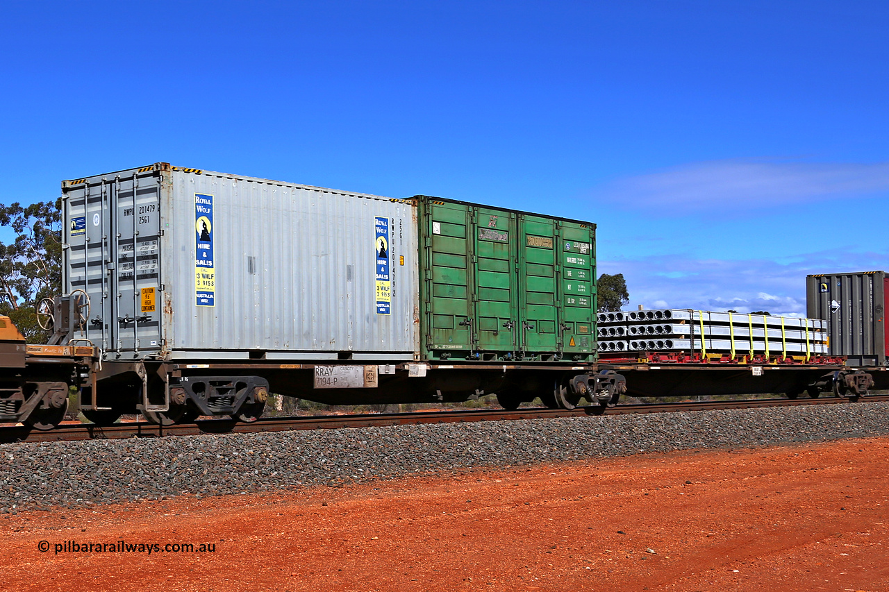 160528 8458
Binduli, intermodal train 6PM6, RRAY 7194 platforms 1 and 2 of 5-pack articulated skeletal waggon set, one of a hundred built by ABB Engineering NSW between 1996-2000, loaded with a 20' Royal Wolf 25G1 type container RWPU 201479[2] and 20' 2PG2 type side door container QLSU 305084[8] on platform 1 and a 40' K&S flatrack KT 118 with concrete panels on platform 2.
Keywords: RRAY-type;RRAY7194;ABB-Engineering-NSW;