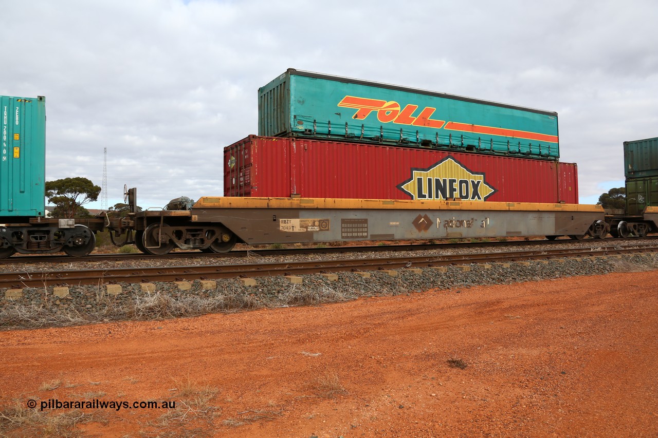 160529 8772
Parkeston, 6MP4 intermodal train, RRZY 7049 platform 5 of 5-pack well waggon set, one of thirty two sets built by Goninan NSW in 1995-96 for National Rail as RQZY type, recoded to RRZY when repaired with a Linfox 48' MFG1 type container DRC 572 and Toll half height 40' curtainsider 5TC 226.
Keywords: RRZY-type;RRZY7049;Goninan-NSW;RQZY-type;