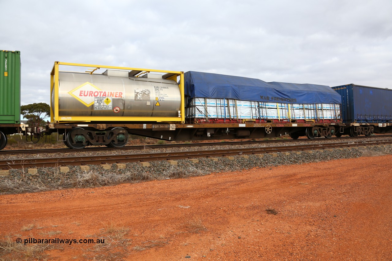 160529 8779
Parkeston, 6MP4 intermodal train, RQSY 34458 one of one hundred OCY type container flat waggons built by Tulloch Ltd NSW in 1974/75, recoded to NQOY, then NQSY. Loaded with a 20' CIMC Tank built Eurotainer 22K2 type ISO tank EURU 191850[0] for ammonium nitrate solution and a 40' K&S flatrack KT 400201 with a tarped load of Timber Link products.
Keywords: RQSY-type;RQSY34458;Tulloch-Ltd-NSW;OCY-type;NQOY-type;