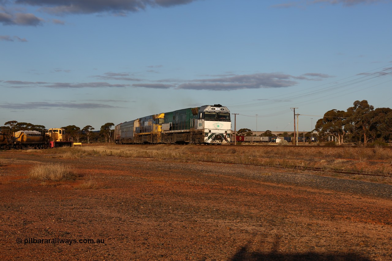160529 9077
Parkeston, 7MP7 priority service train powers around the curve as it climbs the grade to Kalgoorlie behind a pair of Goninan built GE model Cv40-9i NR class units NR 84 serial 7250-04/97-286 and NR 80 serial 7250-03/97-282. NR 84 wears the Southern Spirit livery and is known as the Minty. Off to the left is Loongana Lime shunt loco DE 49, a former BHP 37 class unit built by Goninan in 1961 based on GE 80 ton switcher, serial 4970-013.
Keywords: NR-class;NR84;NR80;Goninan;GE;Cv40-9i;7250-04/97-286;7250-03/97-282;