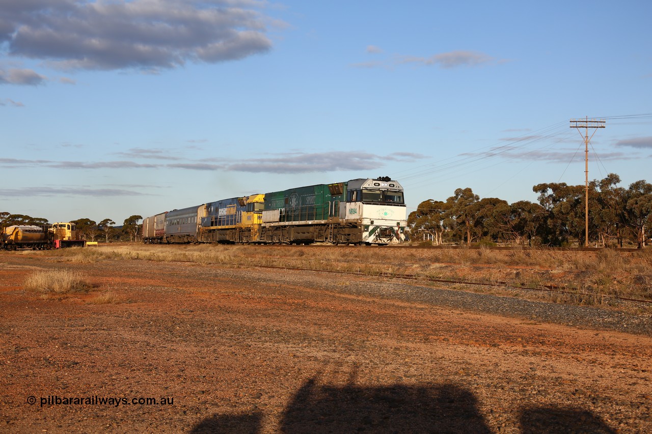 160529 9078
Parkeston, 7MP7 priority service train powers around the curve as it climbs the grade to Kalgoorlie behind a pair of Goninan built GE model Cv40-9i NR class units NR 84 serial 7250-04/97-286 and NR 80 serial 7250-03/97-282. NR 84 wears the Southern Spirit livery and is known as the Minty. Off to the left is Loongana Lime shunt loco DE 49, a former BHP 37 class unit built by Goninan in 1961 based on GE 80 ton switcher, serial 4970-013.
Keywords: NR-class;NR84;NR80;Goninan;GE;Cv40-9i;7250-04/97-286;7250-03/97-282;