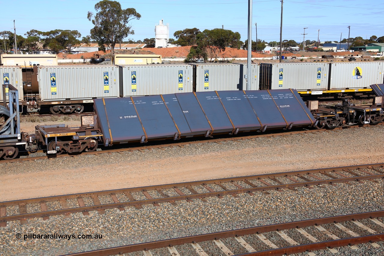 160531 9927
West Kalgoorlie, 1MP2 steel train, RKYY type wide steel plate tilt waggon RKYY 7088, one of twenty seven units built by AN Rail Islington Workshops in 1995-96. Loaded with steel plate.
Keywords: RKYY-type;RKYY7088;AN-Islington-WS;
