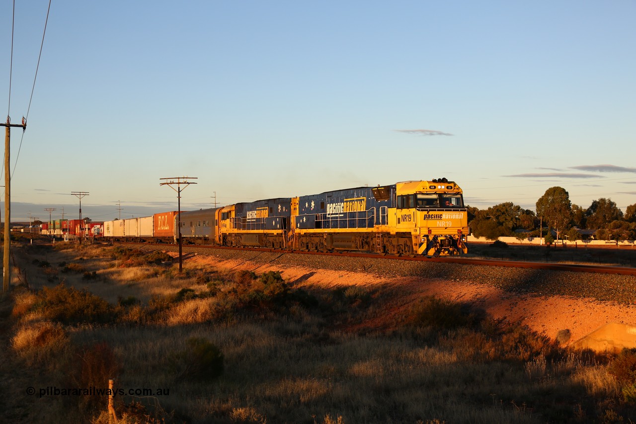 160601 10087
West Kalgoorlie, 2MP5 intermodal service climbs up the grade from Kalgoorlie across Gateacre Road at the 651 km post behind Goninan built GE model Cv40-9i NR class unit NR 19 serial 7250-03/97-221 and a sister unit and 24 waggons for 1464 metres and 3936 tonnes.
Keywords: NR-class;NR19;Goninan;GE;Cv40-9i;7250-03/97-221;