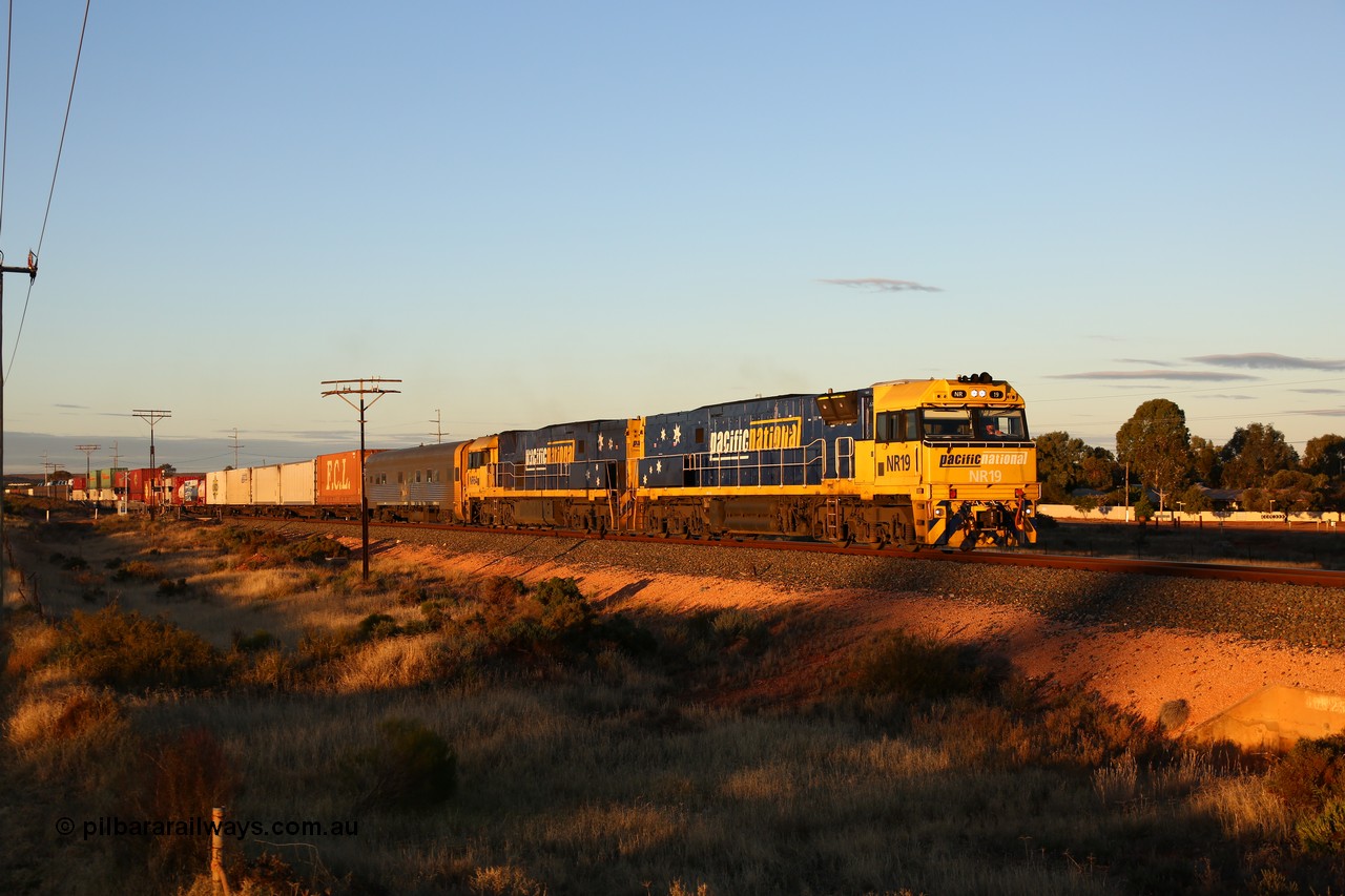 160601 10088
West Kalgoorlie, 2MP5 intermodal service climbs up the grade from Kalgoorlie across Gateacre Road at the 651 km post behind Goninan built GE model Cv40-9i NR class unit NR 19 serial 7250-03/97-221 and a sister unit and 24 waggons for 1464 metres and 3936 tonnes.
Keywords: NR-class;NR19;Goninan;GE;Cv40-9i;7250-03/97-221;