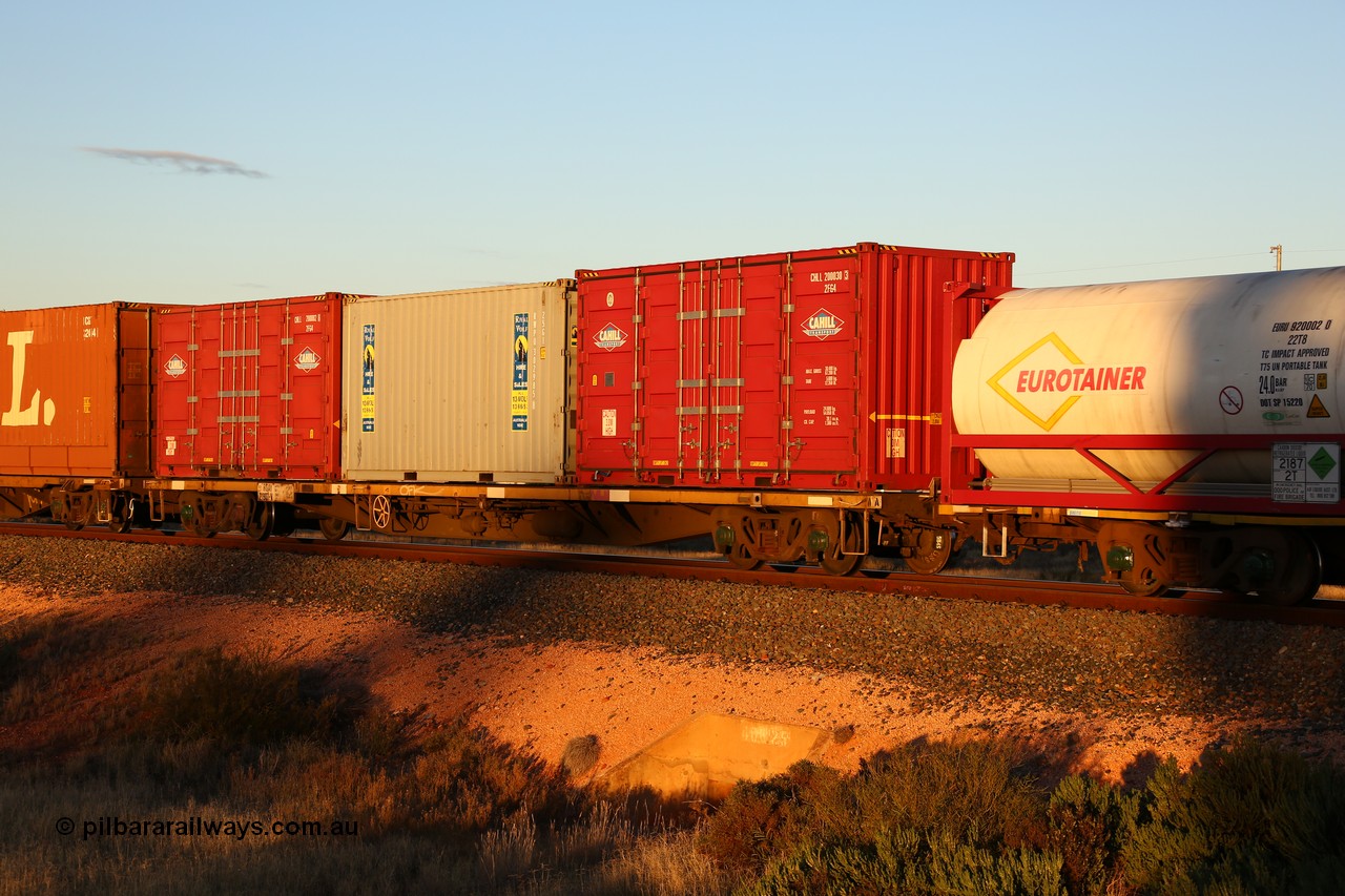 160601 10094
West Kalgoorlie, 2MP5 intermodal train, RQAY 21907 container waggon, one of a hundred waggons built in 1981 by EPT NSW as type NQAY, recoded to RQAY in 1994. Loaded with two Cahill Transport 20' 2FG4 type side door containers CHLL 200030[3] and CHLL 200002[6] with Royal Wolf 20' 22G1 type box RWPU 302985[8].
Keywords: RQAY-type;RQAY21907;EPT-NSW;NQAY-type;