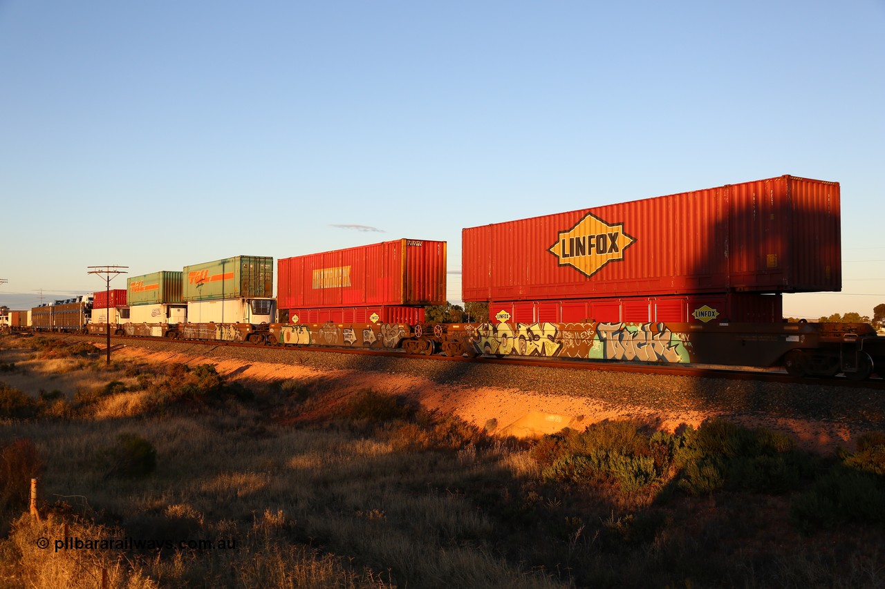160601 10096
West Kalgoorlie, 2MP5 intermodal train, 5-pack RRRY 7007 well waggon set, one of nineteen built in China at Zhuzhou Rolling Stock Works for Goninan in 2005, double stacked with a range of types and sizes including 53' auto boxes, 40' half height side doors, 46' 6