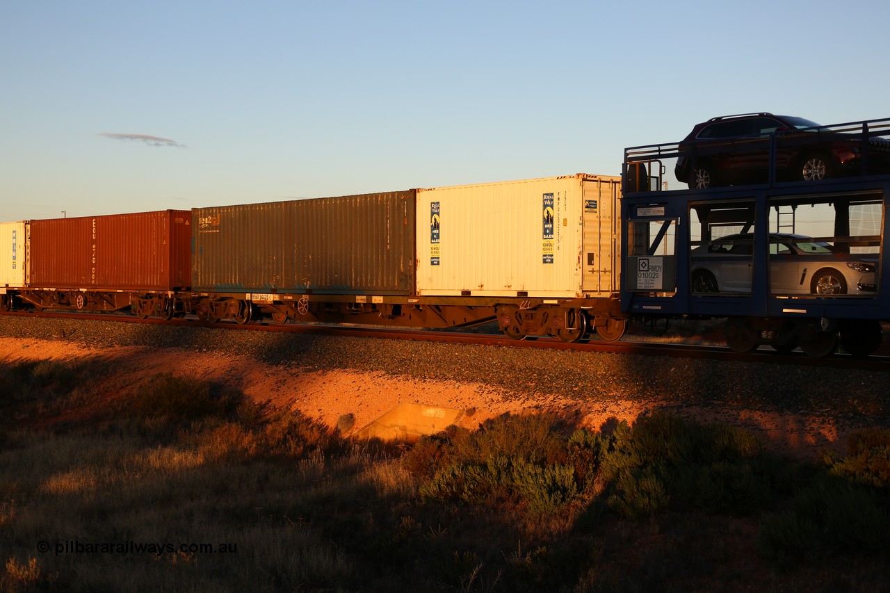 160601 10099
West Kalgoorlie, 2MP5 intermodal train, RQGY 34425, one of a hundred built by Tulloch Ltd NSW as OCY type in 1974/75, recoded to NQOY, then modified to NQGY. Loaded with Royal Wolf 20' 25G1 type box RWPU 202275[6] and sea2rail 40' 4EG1 type box AUSU 407168[4].
Keywords: RQGY-type;RQGY34425;Tulloch-Ltd-NSW;OCY-type;NQOY-type;NQGY-type;