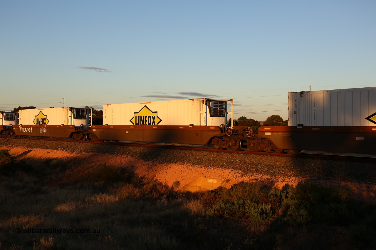 160601 10102
West Kalgoorlie, 2MP5 intermodal train, platform 4 of 5-pack RRRY 7011 well waggon set, one of nineteen built in China at Zhuzhou Rolling Stock Works for Goninan in 2005, Linfox 46' 6