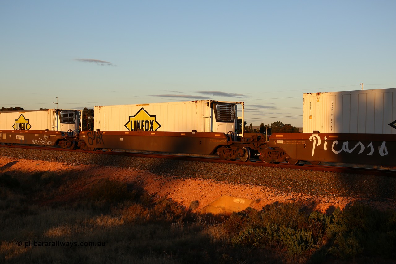 160601 10104
West Kalgoorlie, 2MP5 intermodal train, platform 2 of 5-pack RRRY 7011 well waggon set, one of nineteen built in China at Zhuzhou Rolling Stock Works for Goninan in 2005, Linfox 46' 6