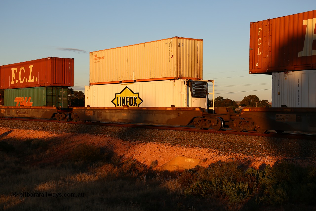 160601 10109
West Kalgoorlie, 2MP5 intermodal train, RRZY 7019 platform 2 of 5-pack well waggon set of twenty six waggon sets built by Goninan in 1995-96 for National Rail as RQZY, later rebuilt and recoded as RRZY, double stacked with Rail Containers 40' 4EG1 type box TSPD 411018[4] and Linfox 46' 6