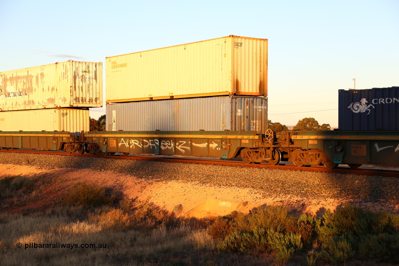 160601 10117
West Kalgoorlie, 2MP5 intermodal train, RRXY 9 platform 2 of 5-pack well waggon set, one of eleven built by Bradken Qld in 2002 for Toll from a Williams-Worley design with a 40' Royal Wolf plain blue box in the well RWVU 400280 and Rail Containers SCFU 412192 on top.
Keywords: RRXY-type;RRXY9;Williams-Worley;Bradken-Rail-Qld;