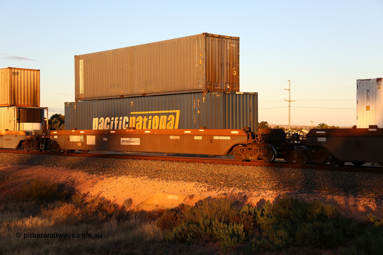 160601 10125
West Kalgoorlie, 2MP5 intermodal train, platform 1 of 5-pack RRRY 7008 well waggon set, one of nineteen built in China at Zhuzhou Rolling Stock Works for Goninan in 2005, double stacked with Pacific National 48' box PNXD 4205 and SCF 40' box SCFU 405052.
Keywords: RRRY-type;RRRY7008;CSR-Zhuzhou-Rolling-Stock-Works-China;
