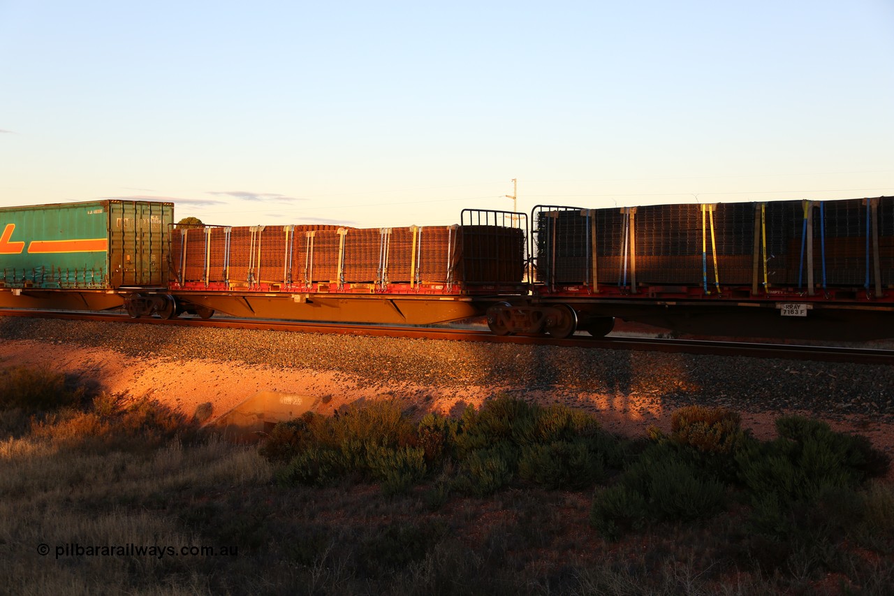 160601 10141
West Kalgoorlie, 2MP5 intermodal train, RRAY 7163 platforms 1 and 2 of 5-pack articulated skel waggon set, 1 of 100 built by ABB Engineering NSW 1996-2000, 40' and 48' decks both with K&S 40'  flatracks loaded with reo mesh, KT 400254 and KT 400279.
Keywords: RRAY-type;RRAY7163;ABB-Engineering-NSW;