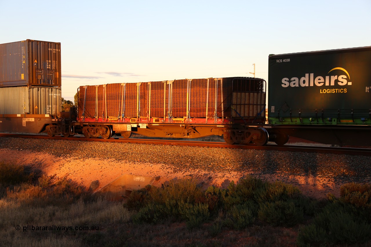 160601 10144
West Kalgoorlie, 2MP5 intermodal train, RRAY 7163 platform 5 of 5-pack articulated skel waggon set, 1 of 100 built by ABB Engineering NSW 1996-2000, 40' deck with a K&S 40' flatrack KT 140 loaded with reo mesh.
Keywords: RRAY-type;RRAY7163;ABB-Engineering-NSW;