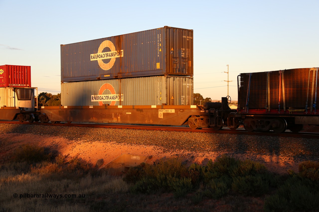 160601 10145
West Kalgoorlie, 2MP5 intermodal train, RRZY 7008 platform 5 of 5-pack well waggon set, the prototype of the RQZY type, first of twenty six sets built by Goninan in 1995-96 for National Rail, later rebuilt and recoded RRZY with double stacked Railroad Transport 40' boxes, 4FP9 type RRTU 004098[6] 4FG1 type 004068[8].
Keywords: RRZY-type;RRZY7008;Goninan-NSW;RQZY-type;