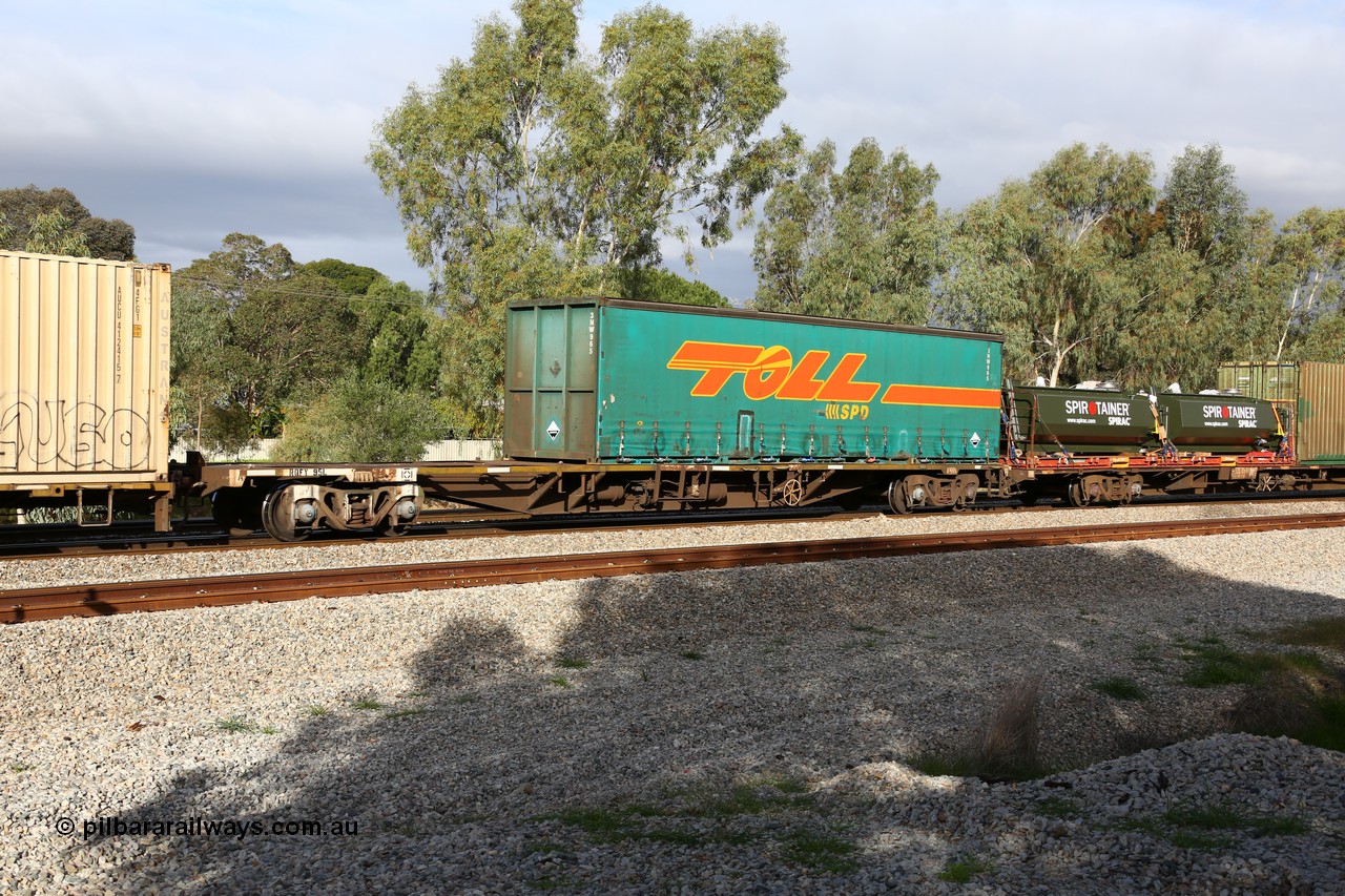 160609 0402
Woodbridge, 5PM5 intermodal train, RQFY 95 container waggon, built by Victorian Railways Bendigo Workshops in 1980 as a batch of seventy five VQFX type skeletal container waggons, recoded to VQFY c1985, then RQFY May 1994, May 1995 to RQFF, then 2CM bogies fitted in Aug 1995 and current code Nov 1995. With a Toll 40' curtainsider 3NW 965.
Keywords: RQFY-type;RQFY95;Victorian-Railways-Bendigo-WS;VQFX-type;VQFY-type;