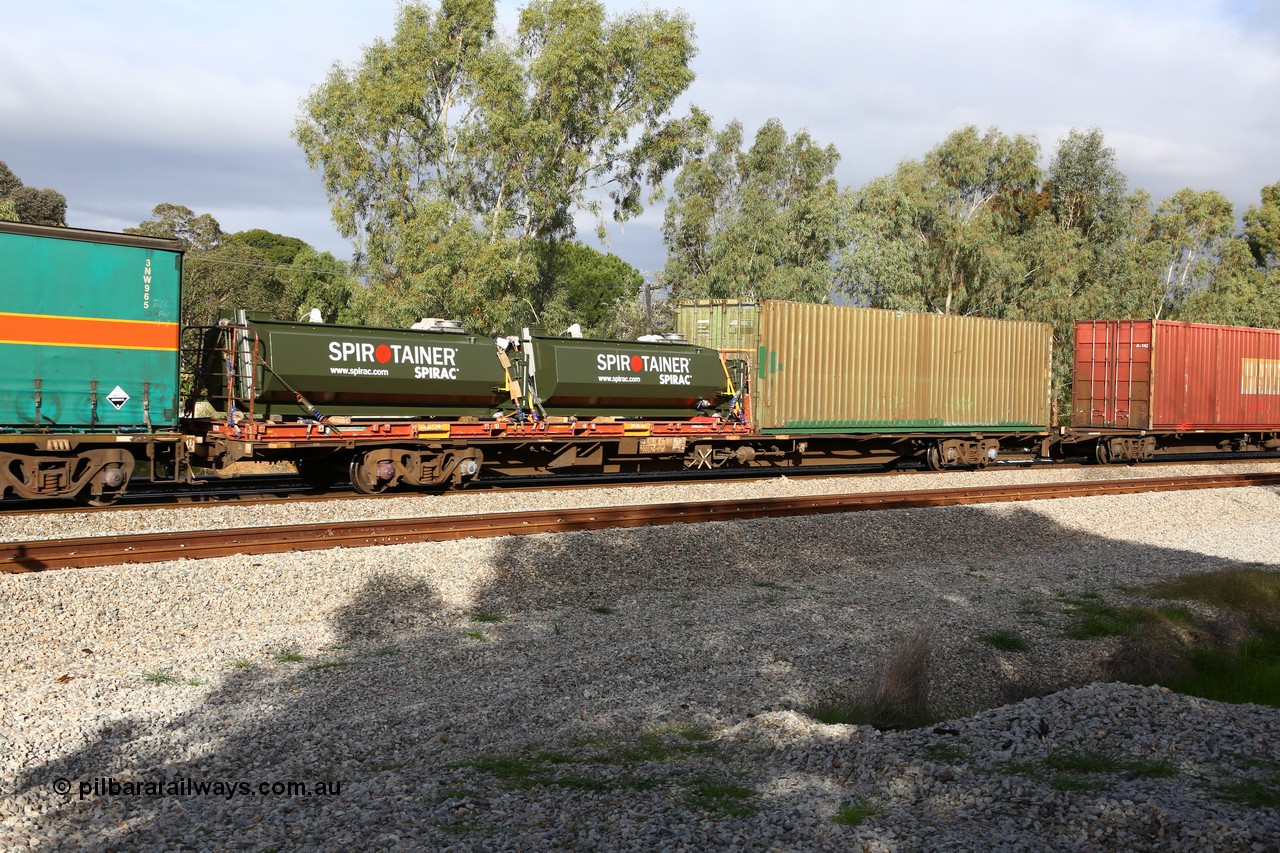 160609 0403
Woodbridge, 5PM5 intermodal train, RQJW 22082, originally built by Mittagong Engineering NSW in 1975-76 in a batch of fifty JCW 80' jumbo container waggons. Recoded to NQJW then to National Rail as RQJW in 1994. Loaded with a Simon 40' flatrack FD 129 with two Spriotainer tanks and Austrans 40' 4EG1 type box AUSU 400423[8].
Keywords: RQJW-type;RQJW22082;Mittagong-Engineering-NSW;JCW-type;NQJW-type;