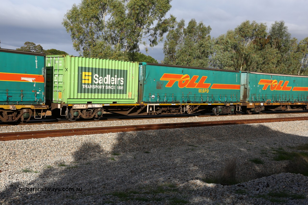 160609 0408
Woodbridge, 5PM5 intermodal train, RQFY 51 container waggon, built by Victorian Railways Newport Workshops in 1978 in a batch of twenty as QMX type skeletal container waggons, Aug 1981 to VQFX, April 1994 to RQFX. Sadleirs 20' 2EB0 box RCSB 5125 and Toll 40' curtainsider NW 4880.
Keywords: RQFY-type;RQFY51;Victorian-Railways-Newport-WS;QMX-type;VQFX-type;