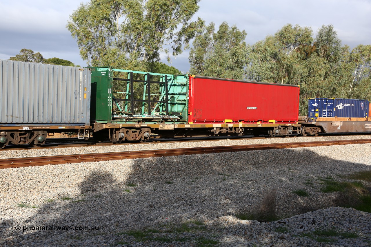 160609 0412
Woodbridge, 5PM5 intermodal train, RQBY 15005, one of seventy that Comeng NSW built as OCY type container flat waggon in 1974-75, recoded to NQOY, then NQSY and NQBY. MLA 02 glass transport 20' container and KTLU 401408 40' curtainsider.
Keywords: RQBY-type;RQBY15005;Comeng-NSW;OCY-type;