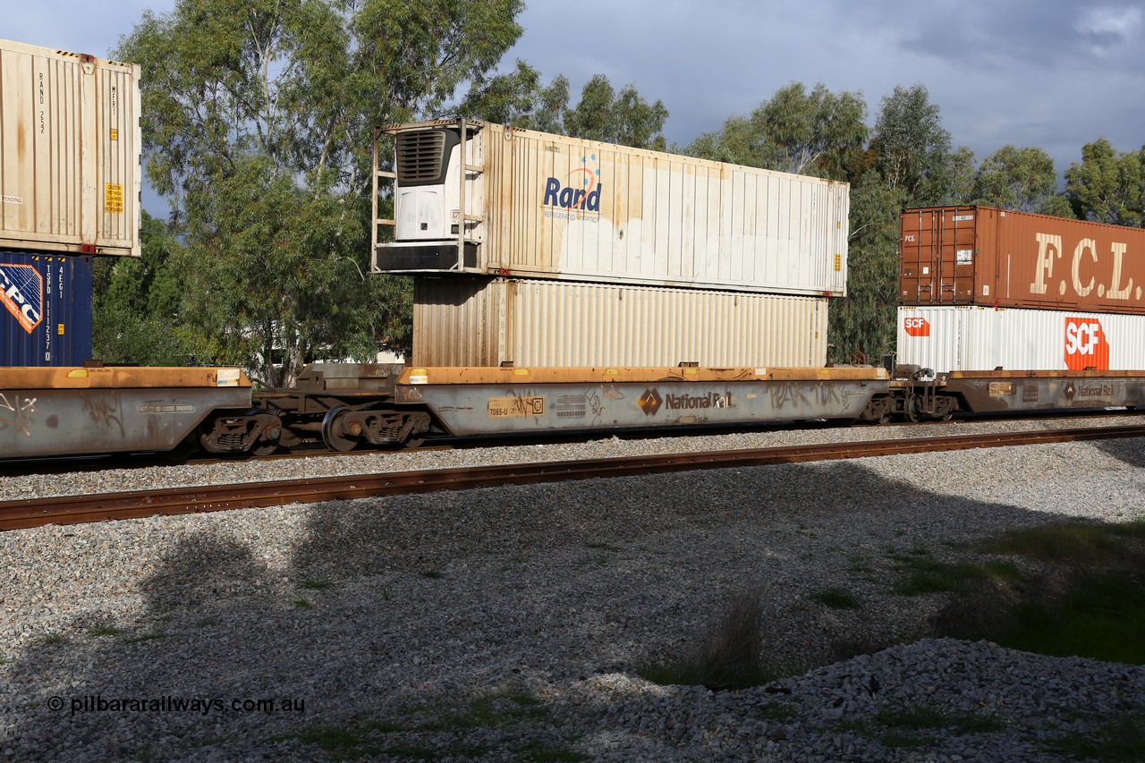 160609 0443
Woodbridge, 5PM5 intermodal train, RQZY 7065 platform 5 of 5-pack well waggon set one of thirty two waggon sets built by Goninan NSW for National Rail in 1995-96, double stacked with a Rand Refrigerated Logistics 46' 6