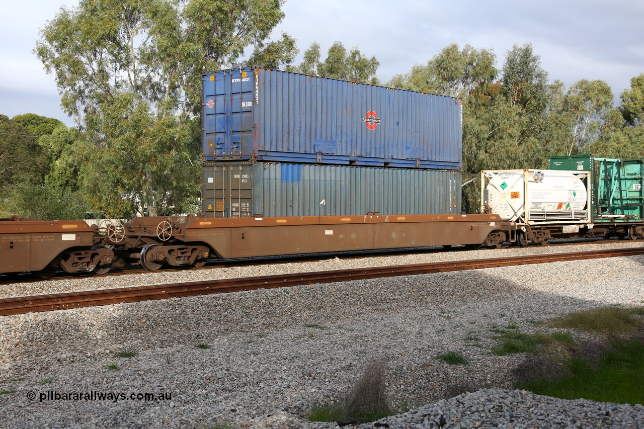 160609 0480
Woodbridge, 5PM5 intermodal train, platform 1 of 5-pack RRRY 7012 well waggon set, one of nineteen built in China at Zhuzhou Rolling Stock Works for Goninan in 2005, double stacked with two 40' boxes, a Railroad Transport container RTPH 4031 and a 4FG1 type MEHU 350033[1] without any logo.
Keywords: RRRY-type;RRRY7012;CSR-Zhuzhou-Rolling-Stock-Works-China;