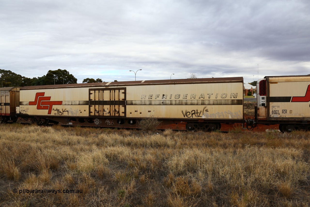 160524 3702
Kalgoorlie, SCT train 2PM9 operating from Perth to Melbourne, ARFY type ARFY 2181 refrigerated van with New Zealand built Fairfax body mounted on an original Commonwealth Railways ROX container waggon built by Comeng Quds in 1970, recoded to AFQX, then AQOX and RQOY before being fitted with the refrigerated body for SCT service circa 1998. 
Keywords: ARFY-type;ARFY2181;Fairfax-NZL;Comeng-Qld;ROX-type;AQOX-type;