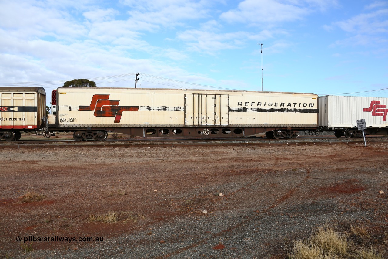 160525 4567
Parkeston, SCT train 3PG1 which operates from Perth to Parkes NSW (Goobang Junction), ARFY type ARFY 2228 refrigerated van with a Ballarat built Maxi-CUBE body mounted on an original Commonwealth Railways ROX container waggon built by Comeng Victoria in 1970, recoded to AFQX, AQOY and RQOY before having the Maxi-CUBE refrigerated body added circa 1998 for SCT service.
Keywords: ARFY-type;ARFY2228;Maxi-Cube;Comeng-Vic;ROX-type;AQOX-type;