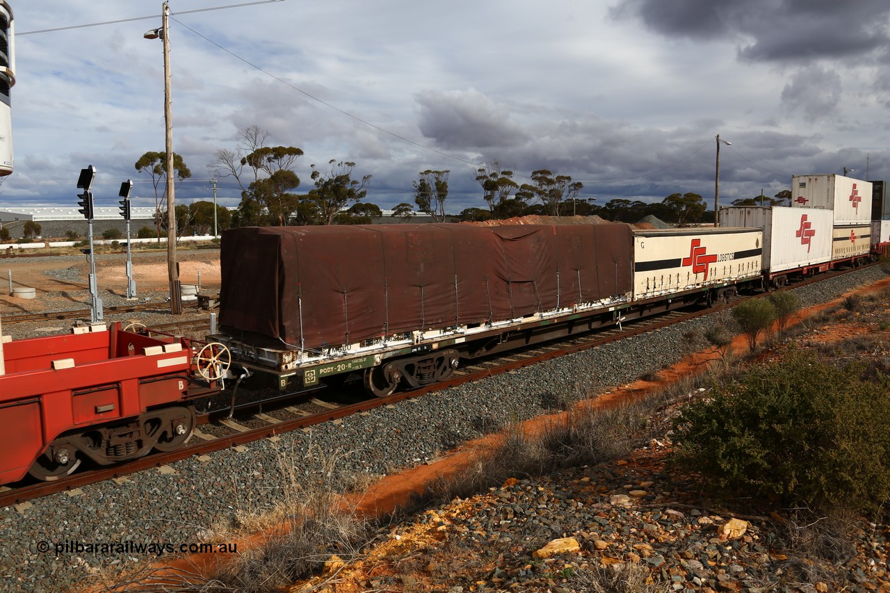 160526 5329
West Kalgoorlie, SCT train 3MP9 operating from Melbourne to Perth, originally built by Victorian Railways Newport Workshops in 1975 as one of twenty five FCF type 'Jumbo' Container Flat waggons built, PQDY 20 still in Freight Australia green livery loaded with a half height 40' former Macfield flatrack MGCU with an SCF tarp and an SCT 40' half height curtainsider.
Keywords: PQDY-type;PQDY20;Victorian-Railways-Newport-WS;FCF-type;FCW-type;VQDW-type;