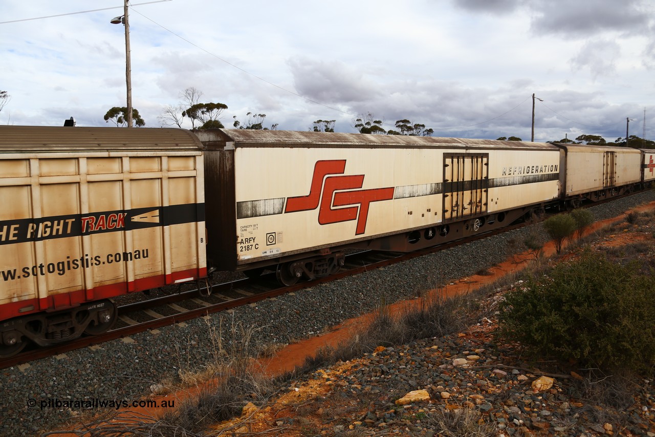 160526 5356
West Kalgoorlie, SCT train 3MP9 operating from Melbourne to Perth, ARFY type ARFY 2187 refrigerated van with the original style short side doors Fairfax (NZL) built fibreglass body that has been fitted to a Comeng Qld 1970 built RO type flat waggon that was in service with Commonwealth Railways and recoded though ROX - AQOX - AQOY - RQOY codes before conversion.
Keywords: ARFY-type;ARFY2187;Fairfax-NZL;Comeng-Qld;RO-type;AQOX-type;