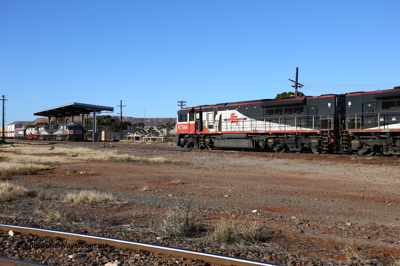160530 9091
Parkeston, return SCT working 1PM9 led by SCT 004 crosses opposing SCT Perth bound train 7GP1 with SCT 013 on the lead waiting on the mainline. Before SCT introduced these AC traction locomotives the original operations were powered by three of four 3000 hp DC locomotives.
Keywords: SCT-class;SCT004;EDI-Downer;EMD;GT46C-ACe;07-1728;