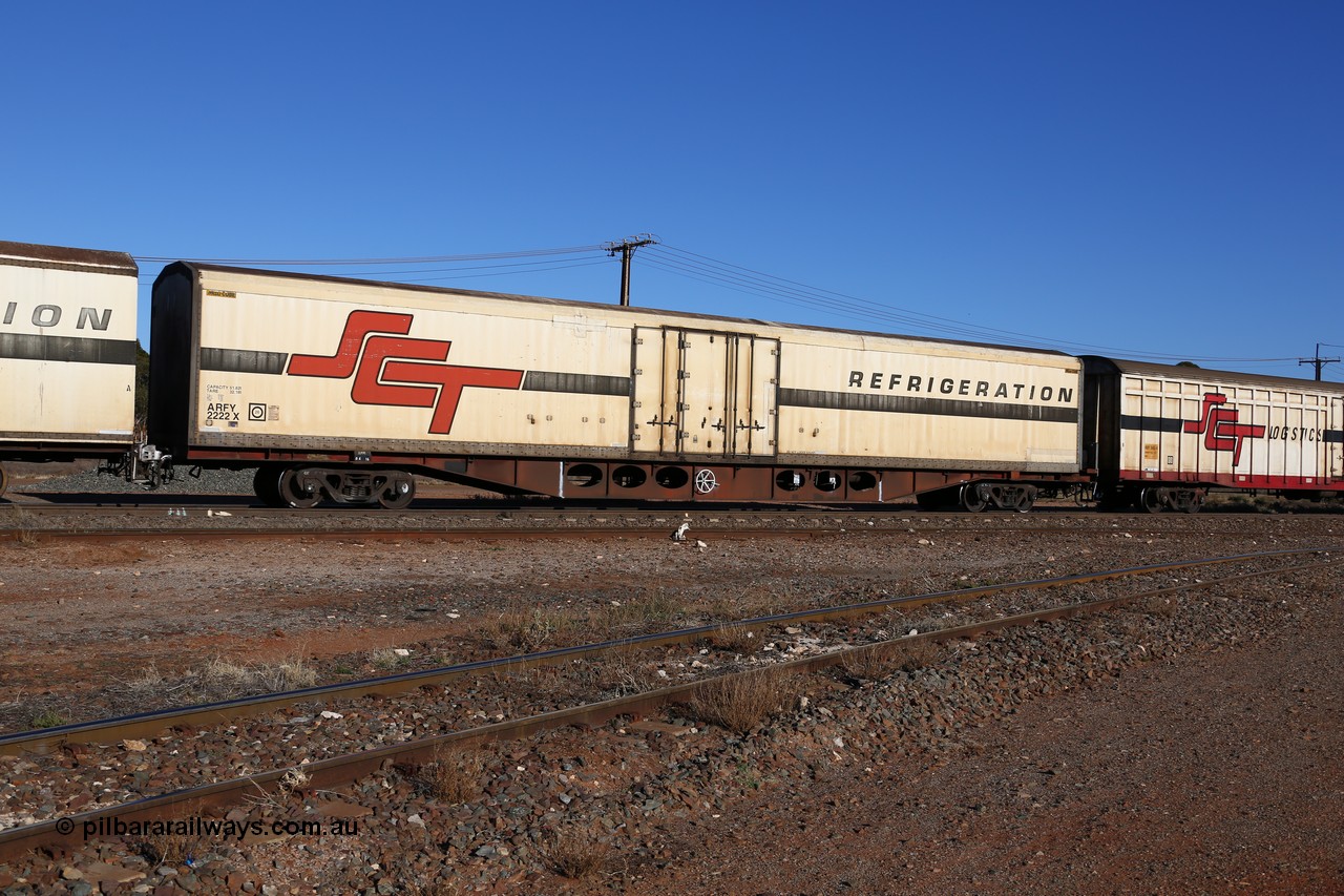 160530 9128
Parkeston, SCT train 1PM9 operates mostly empty from Perth to Melbourne, ARFY type ARFY 2222 refrigerated van with a Ballarat built Maxi-CUBE body mounted on an original Commonwealth Railways ROX container waggon built by Comeng Victoria in 1971, recoded to AQOX and RQOY before having the Maxi-CUBE refrigerated body added circa 1998 for SCT service.
Keywords: ARFY-type;ARFY2222;Maxi-Cube;Comeng-Vic;ROX-type;AQOX-type;