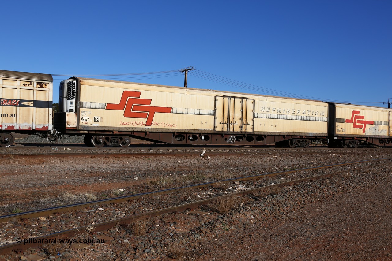 160530 9144
Parkeston, SCT train 1PM9 operates mostly empty from Perth to Melbourne, ARFY type ARFY 2248 refrigerated van with a Ballarat built Maxi-CUBE body mounted on an original Commonwealth Railways ROX container waggon built by Comeng Victoria in 1971, recoded to ROX, RQX, AFQX, AQOY and RQOY before having the Maxi-CUBE refrigerated body added circa 1998 for SCT service.
Keywords: ARFY-type;ARFY2248;Maxi-Cube;Comeng-Vic;ROX-type;AQOX-type;