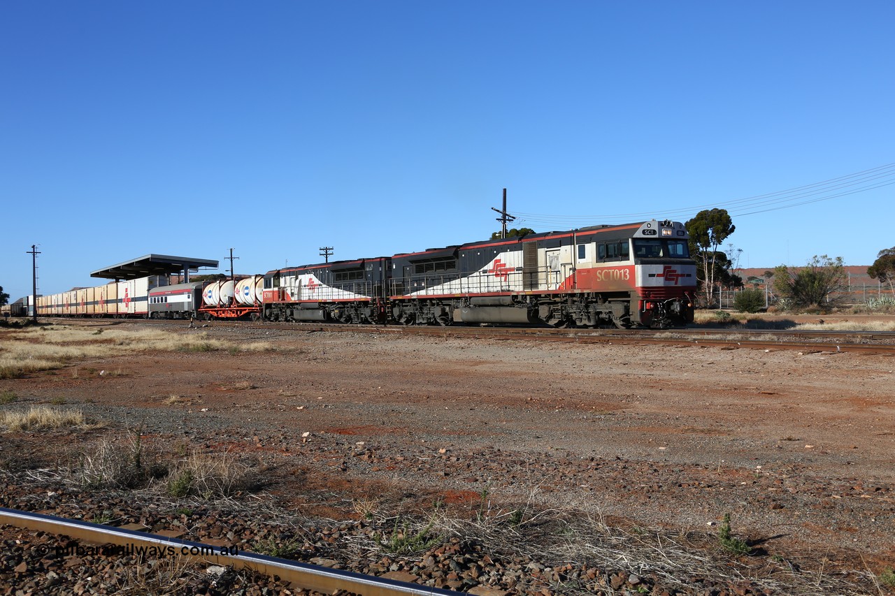 160530 9165
Parkeston, SCT train 7GP1 which operates from Parkes NSW (Goobang Junction) to Perth departs on the mainline behind SCT class SCT 013 serial 08-1737 an EDI Downer built EMD model GT46C-ACe and sister loco SCT 001 with 71 waggons for 5275 tonnes and 1679 metres.
Keywords: SCT-class;SCT013;EDI-Downer;EMD;GT46C-ACe;08-1737;