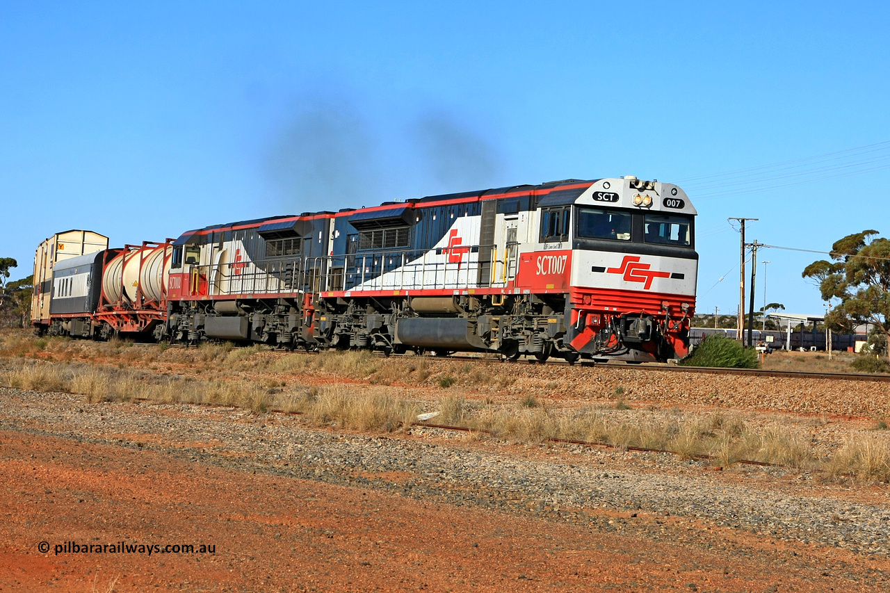 100603 8954
Parkeston, SCT's 3MP9 service operating from Melbourne to Perth with EDI Downer built EMD model GT46C-ACe unit SCT 007 'Geoff (James Bond) Smith' serial 97-1731 leading SCT 002 and 74 waggons for 5674 tonnes and 1782.1 metres in length. 1336 hrs on the 3rd of June 2010.
Keywords: SCT-class;SCT007;EDI-Downer;EMD;GT46C-ACe;07-1731;