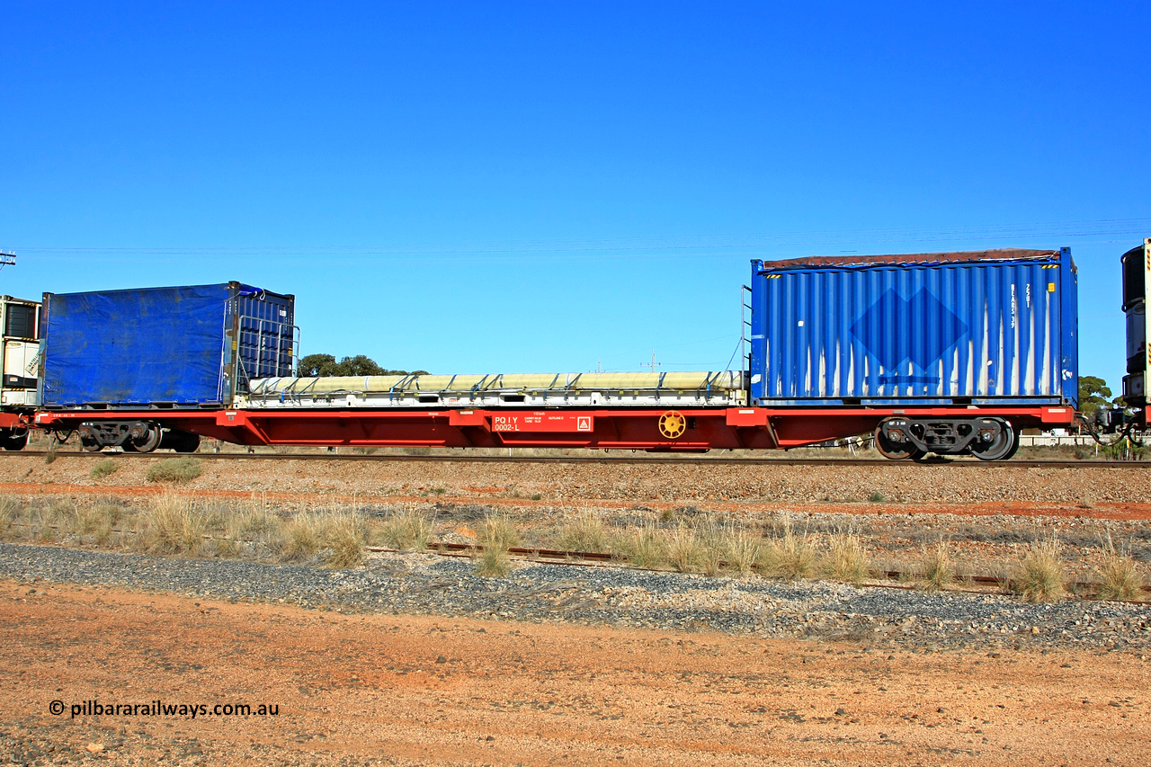 100603 9003
Parkeston, SCT train 3MP9, PQIY type 80' container flat PQIY 0002, one of forty units built by Gemco WA in 2009 loaded with 20' tarp top 25U1 type container BEARS 39, 40' flatrack MGCU 6609522 and 20' DMS Glass container tarped.
Keywords: PQIY-type;PQIY0002;Gemco-WA;