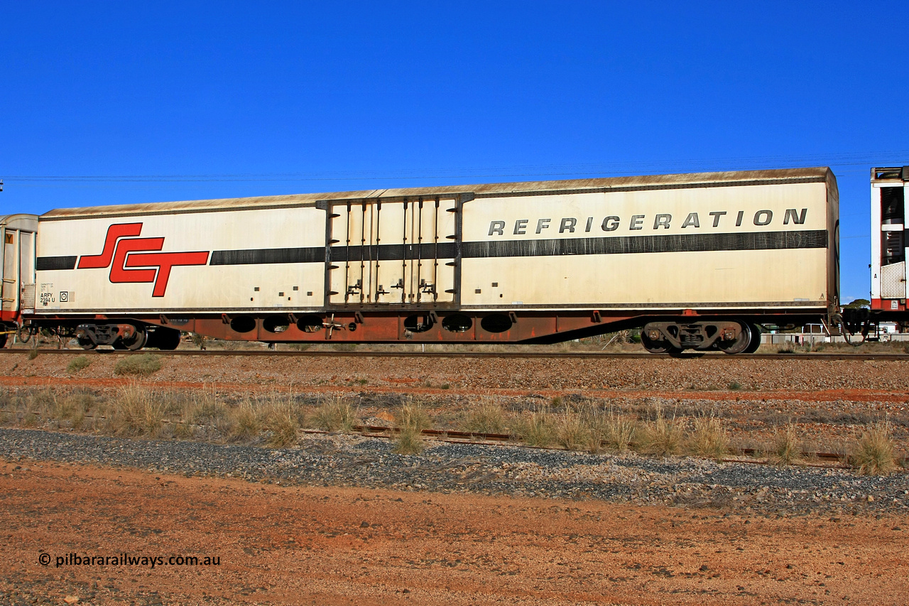 100603 9030
Parkeston, SCT train 3MP9, ARFY type ARFY 2394 refrigerated van with the original style short side doors Fairfax (NZL) built fibreglass body that has been fitted to a Perry Engineering SA 1971 built ROX type flat waggon that was in service with Commonwealth Railways and recoded though RQX - AFQX - AQOY - RQOY codes before conversion.
Keywords: ARFY-type;ARFY2394;Fairfax-NZL;Perry-Engineering-SA;ROX-type;RQX-type;AFQX-type;AQOY-type;RQOY-type;