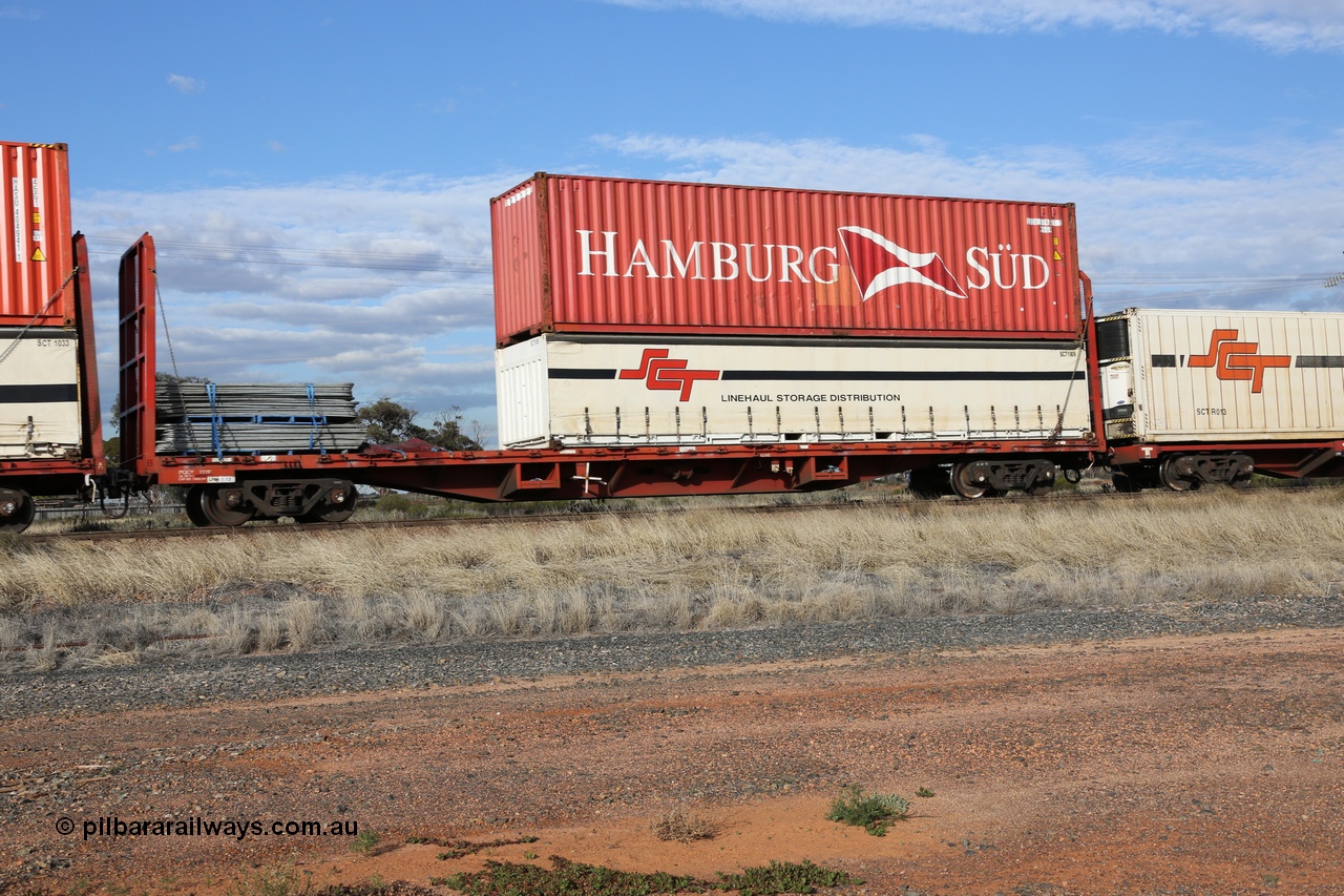 130710 1012
Parkeston, SCT train 3PG1 operating from Perth to Melbourne, PQCY 777 was originally built by Victorian Railways Newport Workshops in 1973 as one of one hundred and twenty five FQX type 60' 3TEU container flat waggons, it was recoded to VQCX in 1980, then to National Rail in November 1994 as RQCX before private ownership and reclassed PQCY type. PQCY 777 is now fitted with bulkheads and here loaded its own gates, and an SCT half height curtain sider 40' container SCT 1009 double stacked with Hamburg Sud 40' 45G1 type container HASU 574817.
Keywords: PQCY-type;PQCY777;Victorian-Railways-Newport-WS;FQX-type;VQCX-type;RQCX-type;