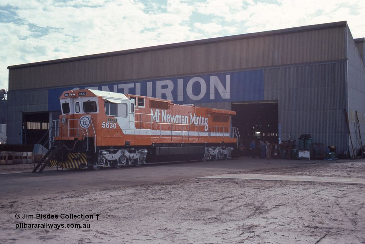 1051 001
Welshpool, Goninan Open Day 27th August, 1988. Mt Newman Mining's Goninan new build GE CM39-8 model loco 5630 'Zeus' serial 5831-09 / 88-079 out the front of the workshop on display.
Jim Bisdee photo.
Keywords: 5630;Goninan;GE;CM39-8;5831-09/88-079;
