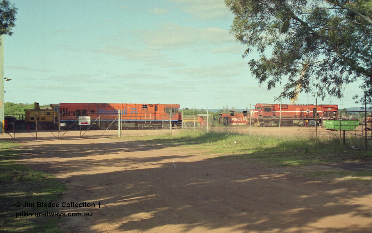 16947
Bassendean, an overview of the rear of Goninan's workshops, Westrail P class and Mt Newman Mining's AE Goodwin built ALCo M636 unit 5480 serial G6061-1 being prepped for rebuilding into 5658. October 1993.
Jim Bisdee photo.
Keywords: 5480;AE-Goodwin;ALCo;M636C;G6061-1;